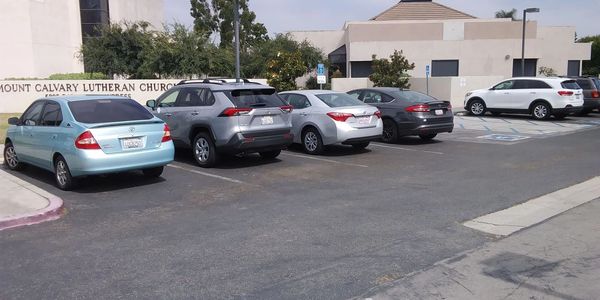 a group of cars parked in a parking lot