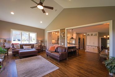 Additional great room and kitchen remodel addition including vaulted ceilings custom cabinetry