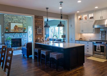 Kitchen remodel with custom Cambria countertop peninsula and tile backsplash