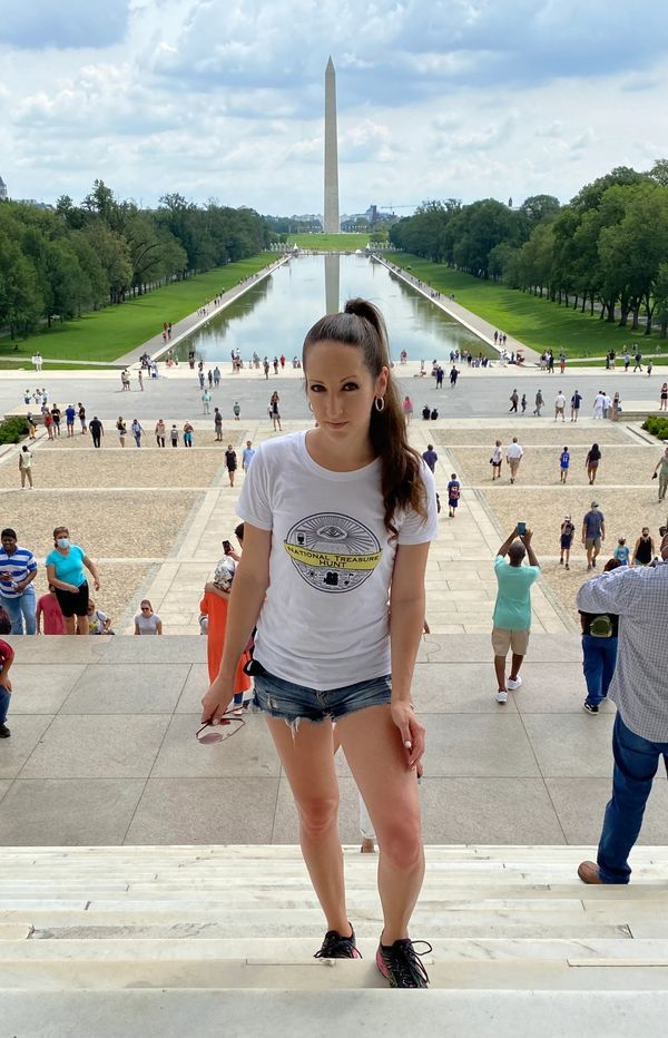 Aubrey posing as Ben Gates wearing her NTH logo shirt.