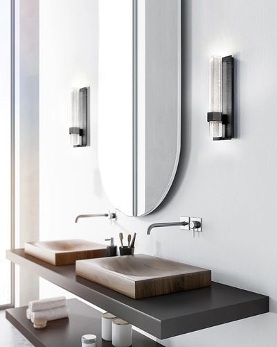 LED wall sconce has a dazzling design. Two slender hexagonal shaped crystals encased with bubbles