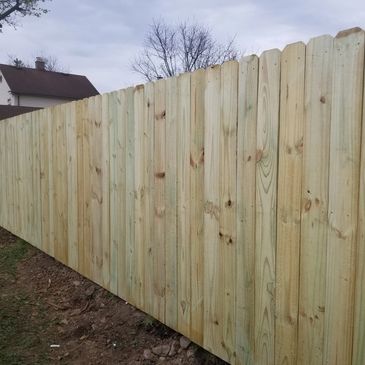 Wooden privacy fence dog eared 
