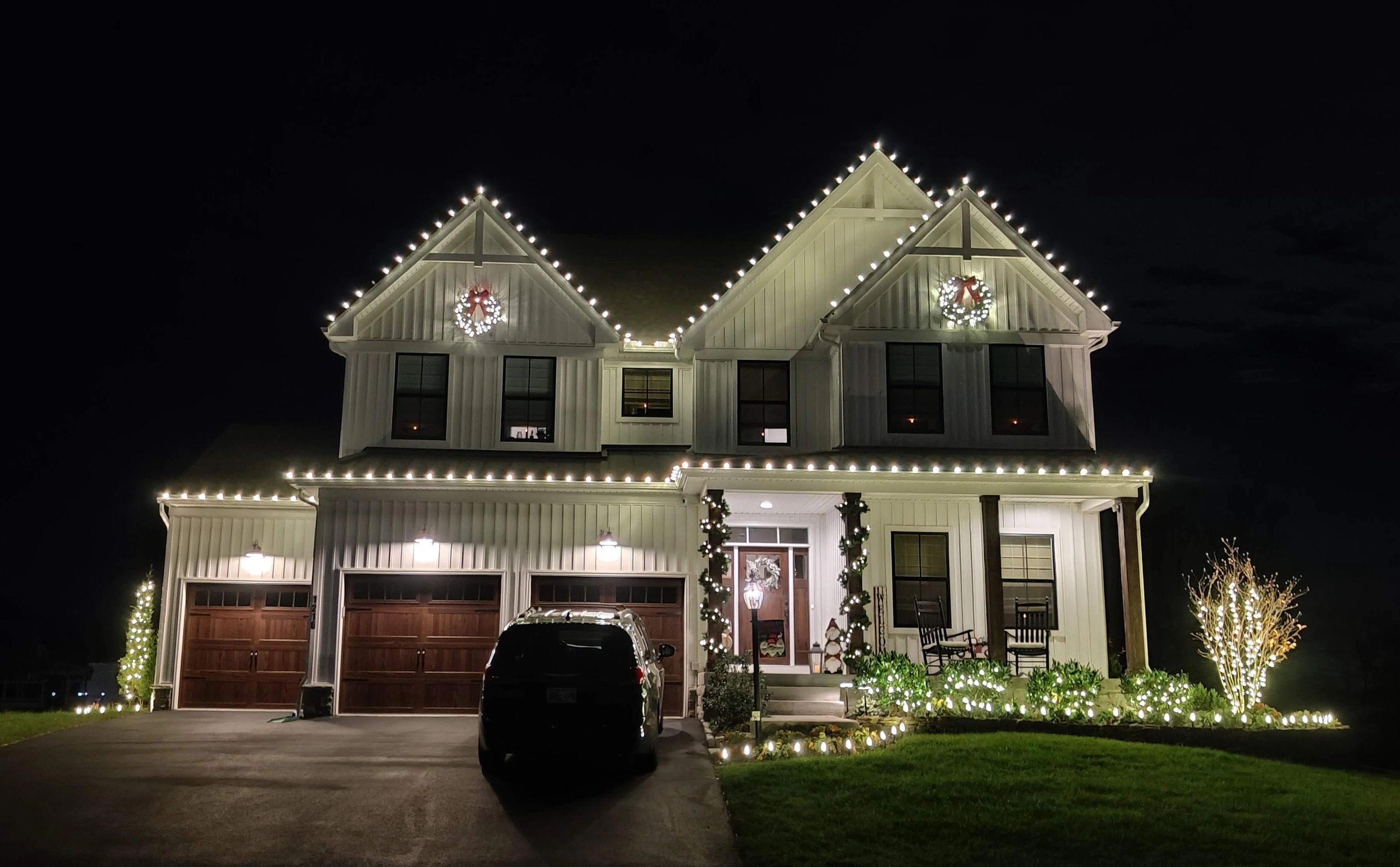 Christmas Lights Installed on residential House outlining roofline with Warm White LED lighting