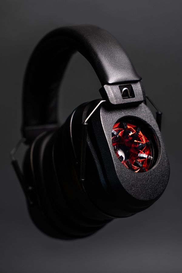 A black background with Black headphone