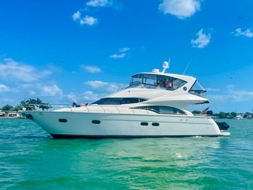 Tendering to a client in his Marquis 59' while in Key West, FL.