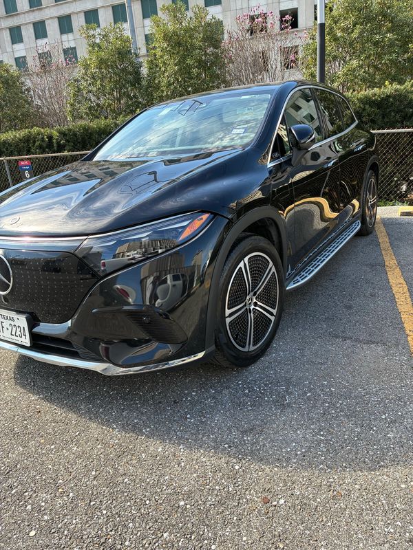 Black Mercedes-Benz SUV parked in a parking lot.