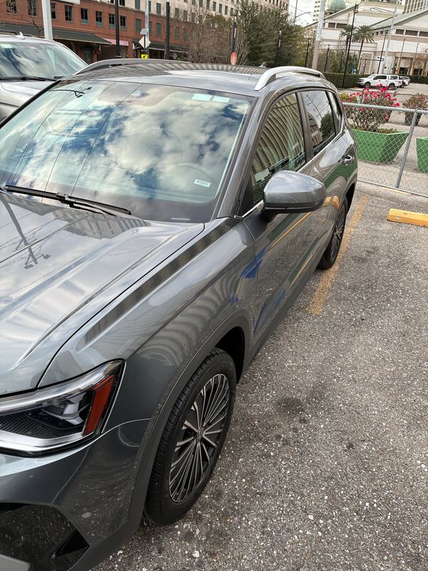 Gray SUV parked in an urban setting.