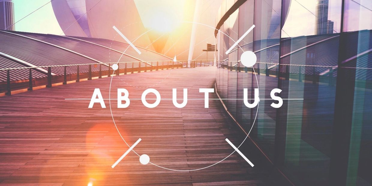 Modern architectural walkway with "About Us" text overlay and warm sunlight.