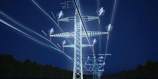 High-voltage power lines with digital overlays under a starry night sky.