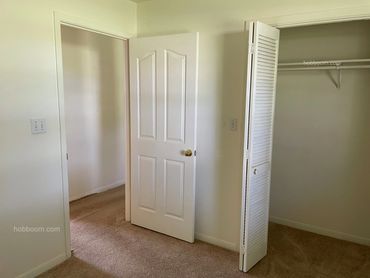Doorway to a bedroom with open closet