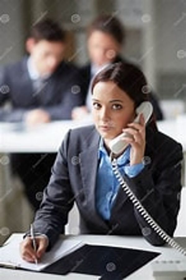Closeup shot of a woman speaking on telephone