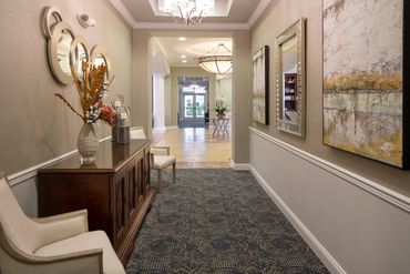 Amenity space renovated hallway with seating, accessories, and art