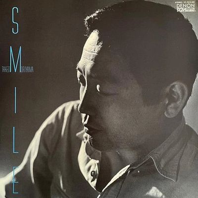 Black and white portrait of a man with a contemplative expression on an album cover.