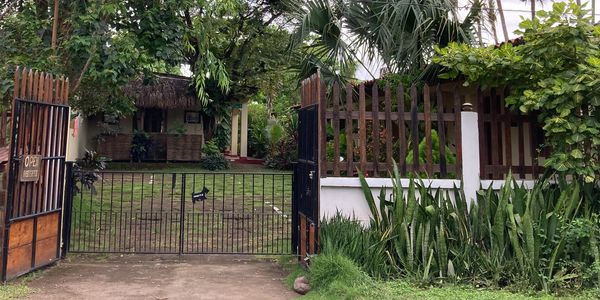 Entrance from the street, secure parking area