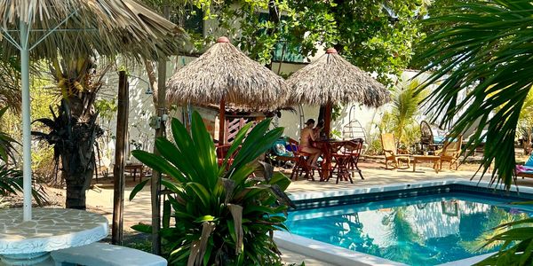 Hotel Tranquilo garden patio and pool area