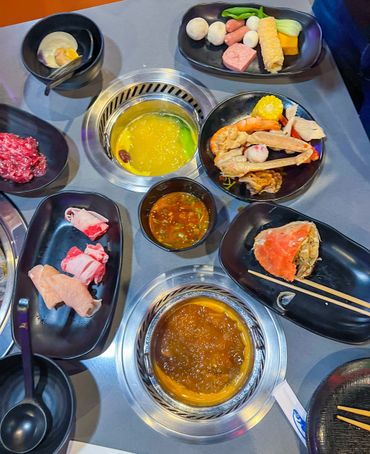 table full of hot pot food