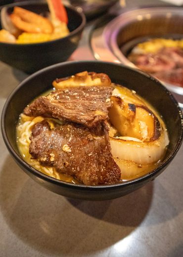 korean bbq in a broth bowl from hot pot