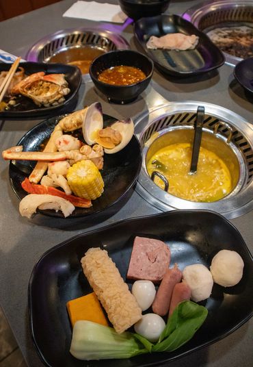 table full of hot pot food