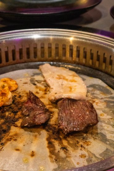 meat on a korean bbq grill