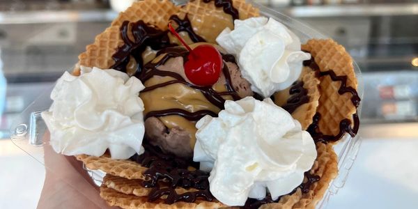 Ice Cream Nachos with chocolate peanut butter ice cream, waffle chips, whipped cream and cherry