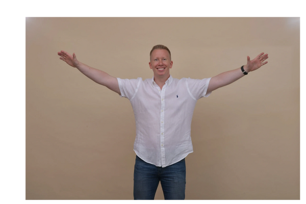 Author Matt Main with arms outstretched