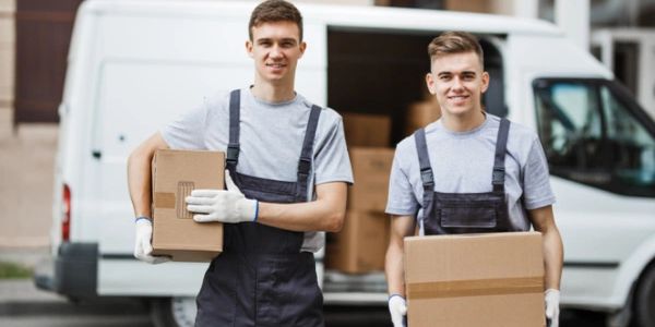 Movers with boxes and moving van
