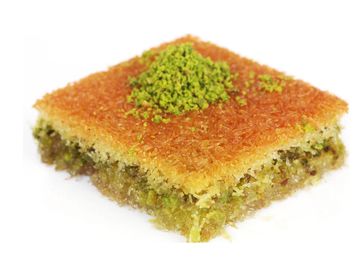 Shredded wheat is pressed out in sheets and filled with pistachio, sweetened with hot syrup.