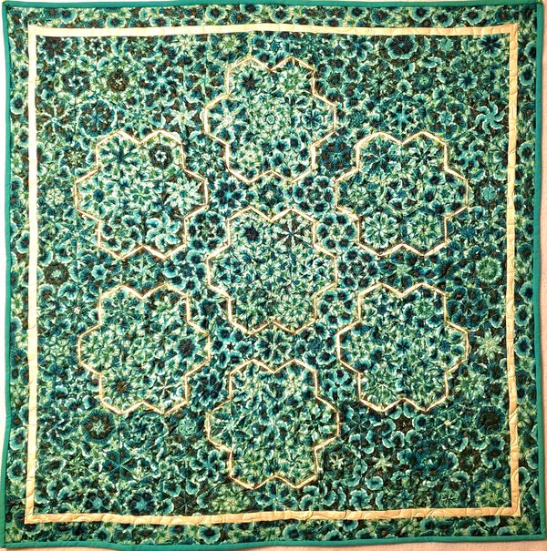 “Green Garden,” quilt, 52x52 inches. Fabric is Timeless Treasures Green Water Dance. Made for Maria 