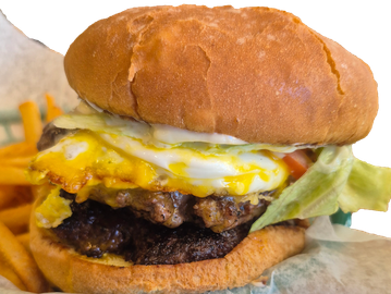 Cheeseburger with egg, lettuce, tomato, and fries.