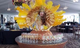 Beautiful show girls greet guests as strolling tables, champagne dress diva, and living statues.