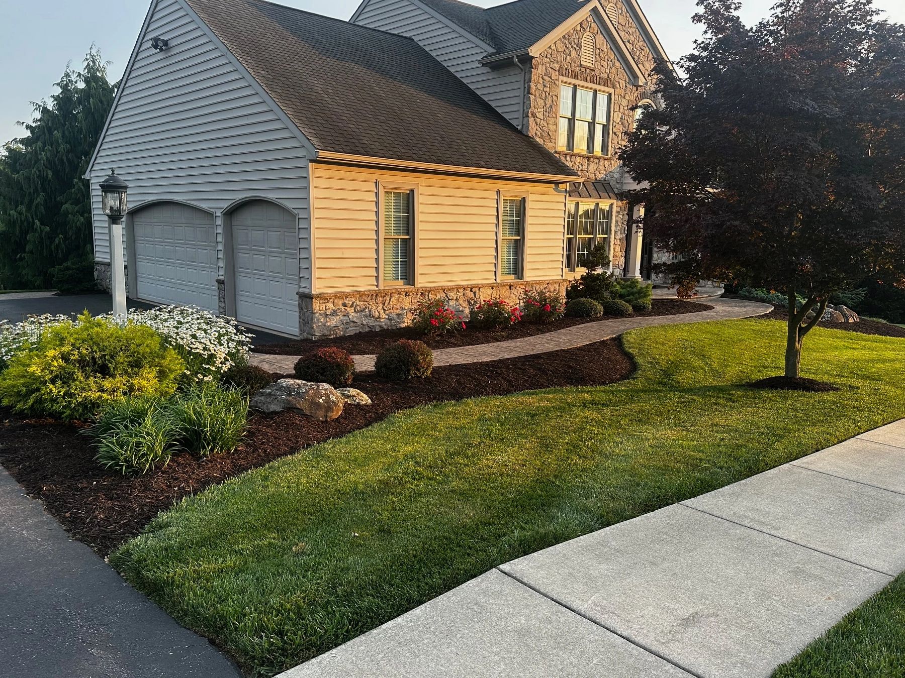 Beautiful suburban house with manicured lawn and garden.