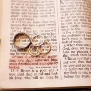 <p>Verse with rings saying no-one can take apart what God has joined together</p>