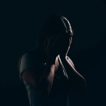 <p>woman depressed in the dark room</p>