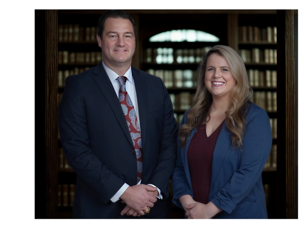Kristin S. Fellers and Brandon K. Fellers standing outside their Virginia Beach law office