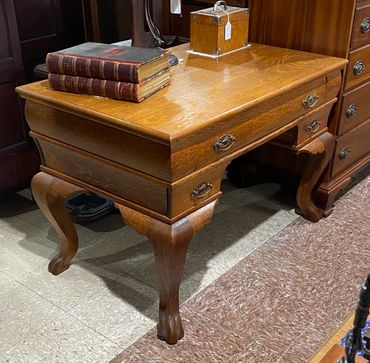 Oak desk, claw feet, excellent refinished condition.