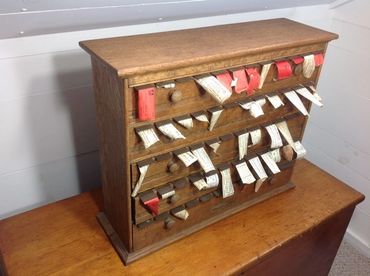 Oak drug store label cabinet