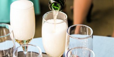 closeup shot of wine being poured in the glass