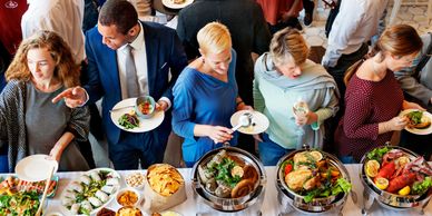 People enjoying buffet at a party