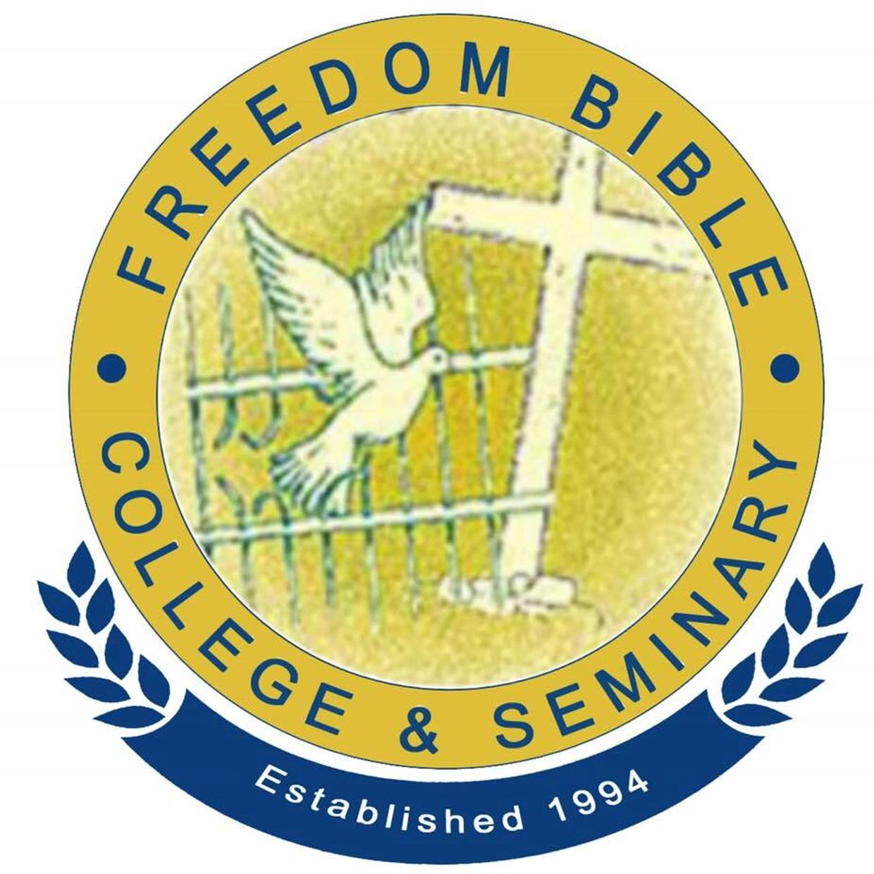 Logo of Freedom Bible College & Seminary with a dove and cross.