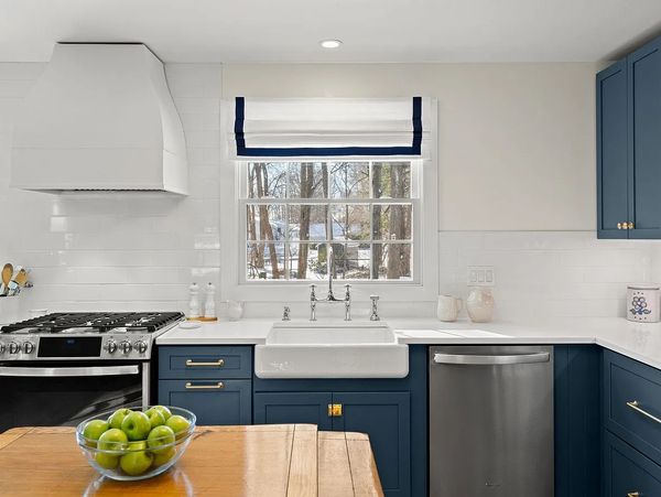 KOHLER whitehaven farmer sink Perrin Rowe polished nickel bridge faucet brass hardware blue kitchen