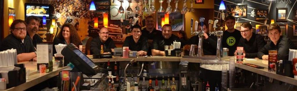 Murphy's big band group posing for a picture at a restaurant & bar