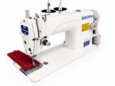 White industrial Stitchline sewing machine with red fabric under the needle.