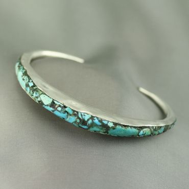 Anticlastic Sterling silver bracelet filled with turquoise

