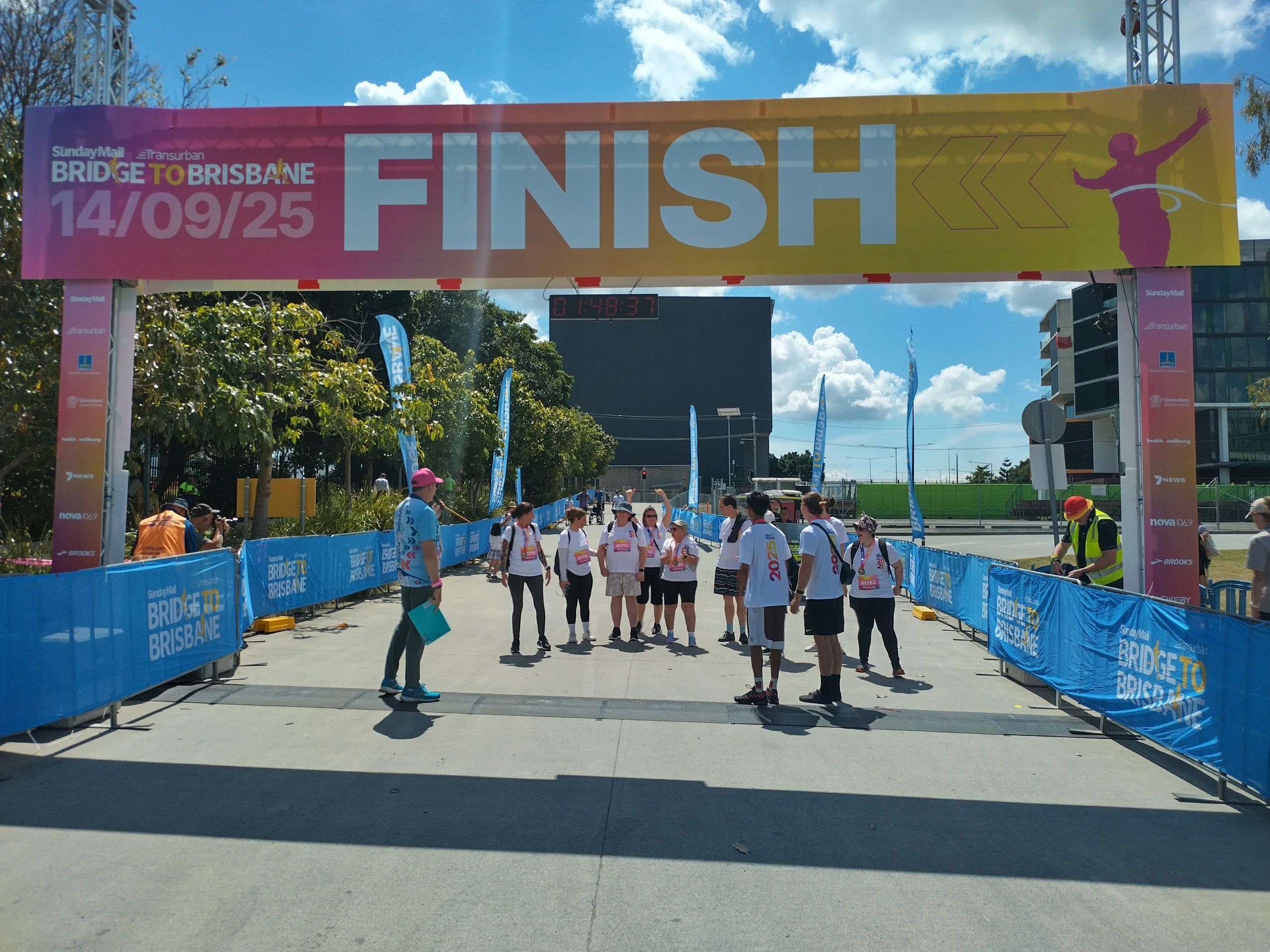 Finish line of Bridge to Brisbane event with participants gathered.