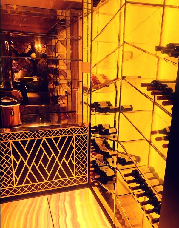 a confusion of beauty 
onyx 
onyx floor
glass shelves
wine cellar
mirrored wall
white & white