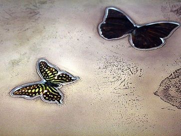 A confusion of beauty
based upon
butterfly
metal table
resin
heather rich