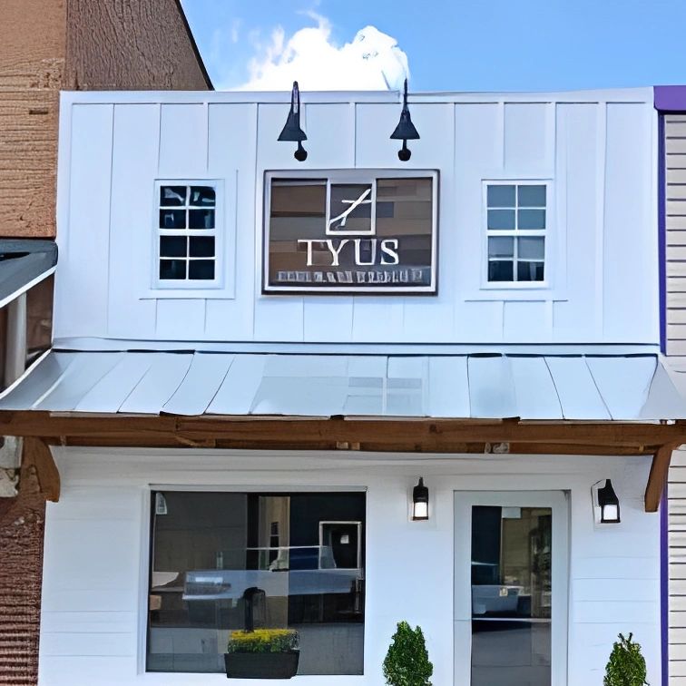 Tyus Insurance Group white storefront building.
