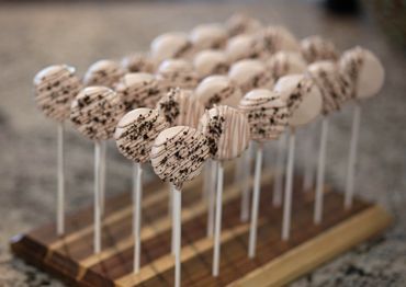 Two dozen cookies and cream cake pops.