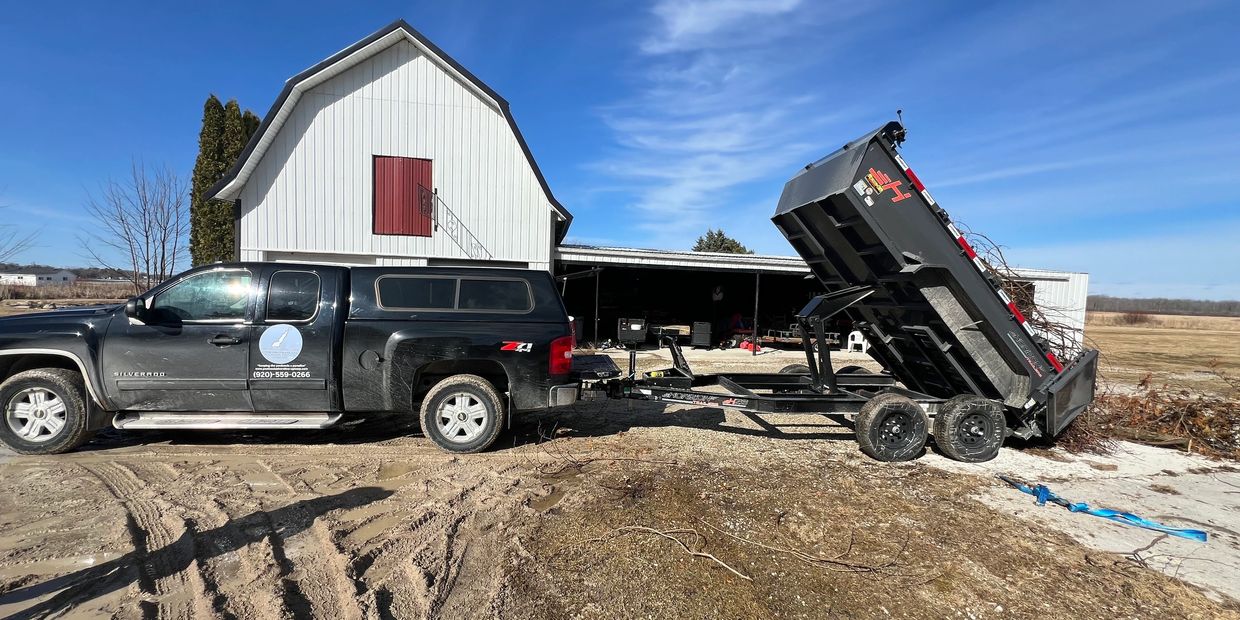 PSU dumping brush from a job in Baileys Harbor with our 2024 Horizon dump trailer!