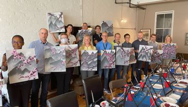 Group of participants at an Art Factory painting event